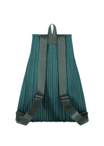 The PLEATS KNAPSACK by PLEATS PLEASE ISSEY MIYAKE in teal features a pleated design, adjustable straps, and a top loop, shown from the back against a white background.