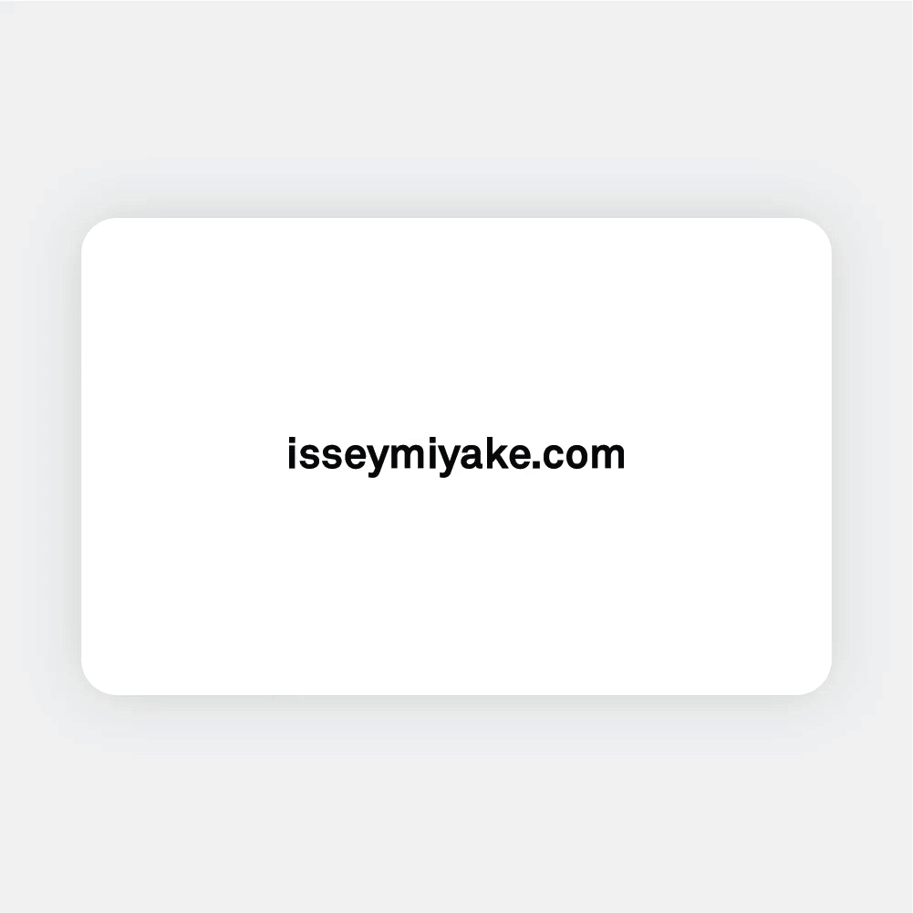 A white card with rounded corners displays the text isseymiyake.com in bold black font, centered on the card—perfect for redeeming an ISSEY MIYAKE USA | Gift Card at the ISSEY MIYAKE ONLINE STORE. view 1 of 1
