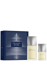 The L’EAU D’ISSEY POUR HOMME EAU DE TOILETTE HOLIDAY SET by ISSEY MIYAKE PARFUMS includes two bottles and comes in a blue box adorned with a geometric white tree design—an iconic men’s fragrance set, ideal for any occasion. - OS