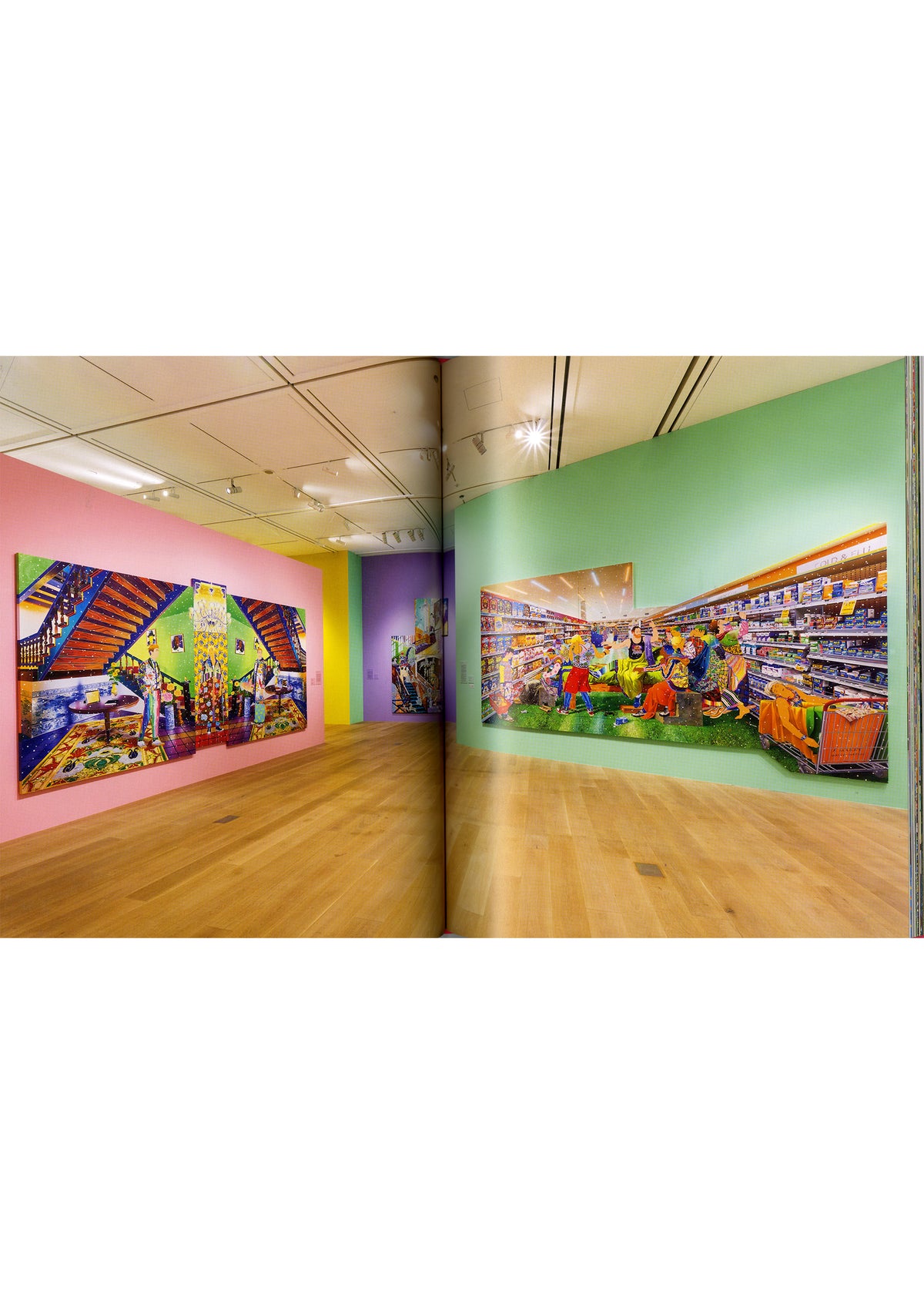 Pastel-hued walls showcase large, dynamic photographs of people in colorful supermarket and stairway settings. As part of the contemporary art exhibition “Matsuyama Tomokazu: FIRST LAST” presented by ISSEY MIYAKE BOOKS at Azabudai Hills Gallery, the space’s wooden floors and ceiling lights create a modern, clean atmosphere that echoes Matsuyama’s vibrant artistic style. view 2 of 6