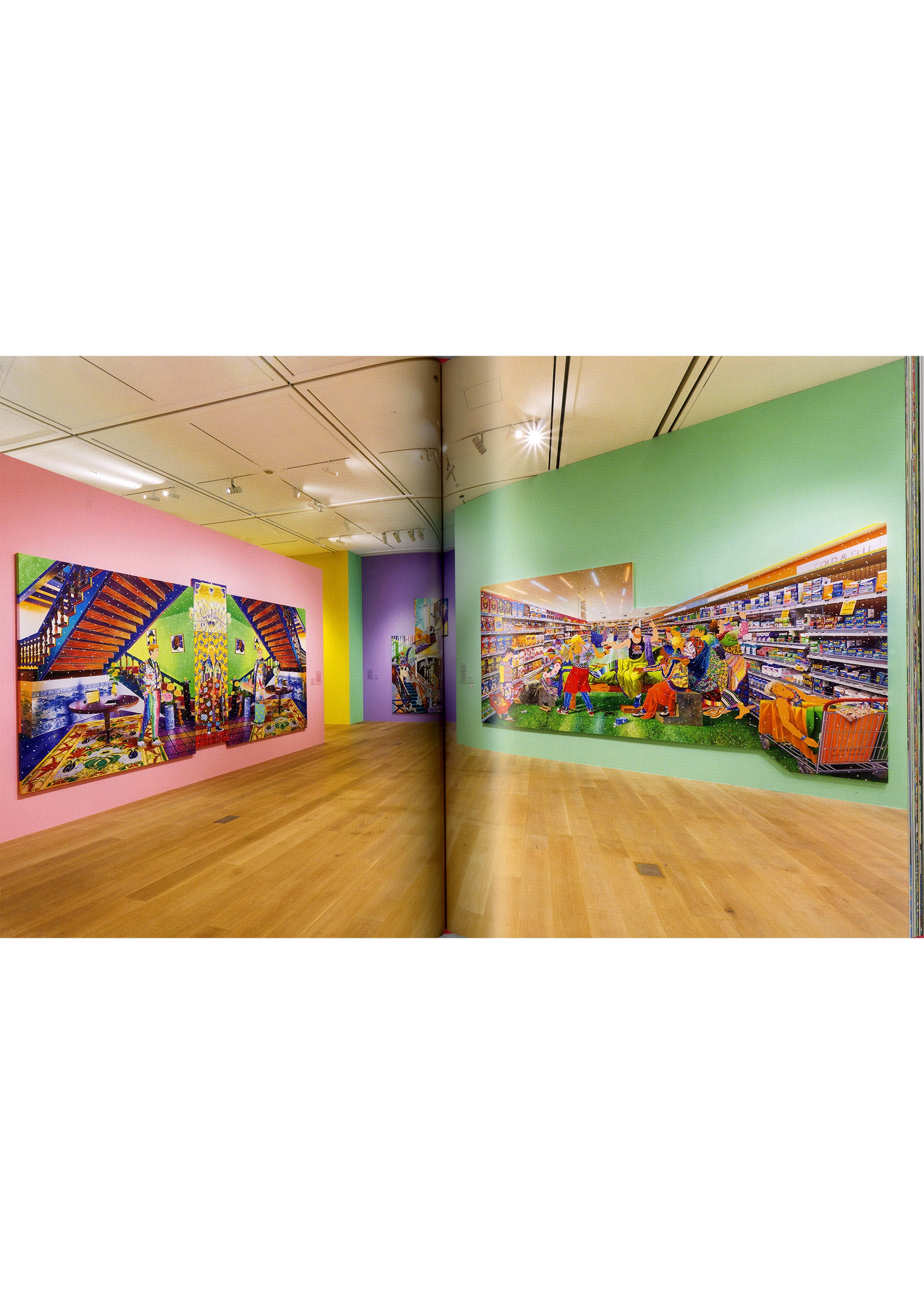 Zoomed view Pastel-hued walls showcase large, dynamic photographs of people in colorful supermarket and stairway settings. As part of the contemporary art exhibition “Matsuyama Tomokazu: FIRST LAST” presented by ISSEY MIYAKE BOOKS at Azabudai Hills Gallery, the space’s wooden floors and ceiling lights create a modern, clean atmosphere that echoes Matsuyama’s vibrant artistic style.