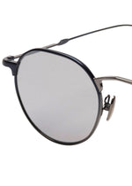 ISSEY MIYAKE EYES PANT Ⅲ round titanium sunglasses with dark metal frames and silver reflective lenses.