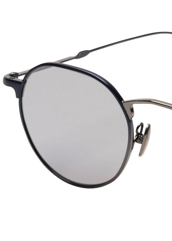 Zoomed view ISSEY MIYAKE EYES PANT Ⅲ round titanium sunglasses with dark metal frames and silver reflective lenses.